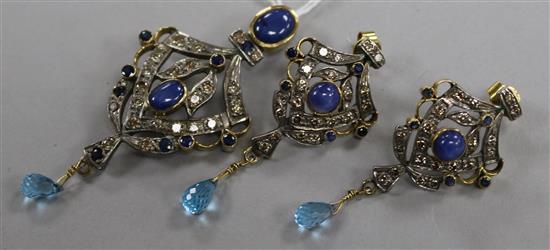 An Indian sapphire and diamond yellow and white metal openwork pendant with topaz drop and a pair of earrings en suite